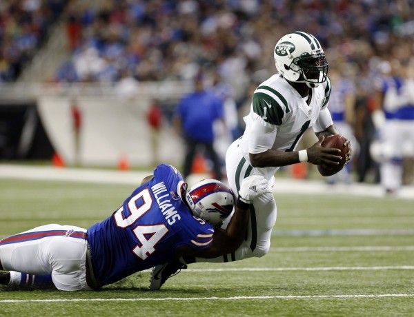 Jets quarterback Michael Vick sacked by Bills defense