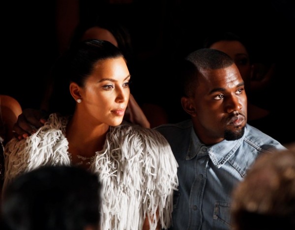 Kanye West embracing Kim Kardashian