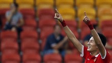 China's Yu Hai celebrates his goal during their Asian Cup Group B soccer match against Saudi Arabia at the Brisbane Stadium in Brisbane