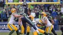Seahawks wide receiver Chris Matthews (13) recovers an onside kick ahead of Green Bay Packers wide receiver Jordy Nelson (87) and Brandon Bostick (86) during the fourth quarter in the NFC Championship Game at CenturyLink Field. 