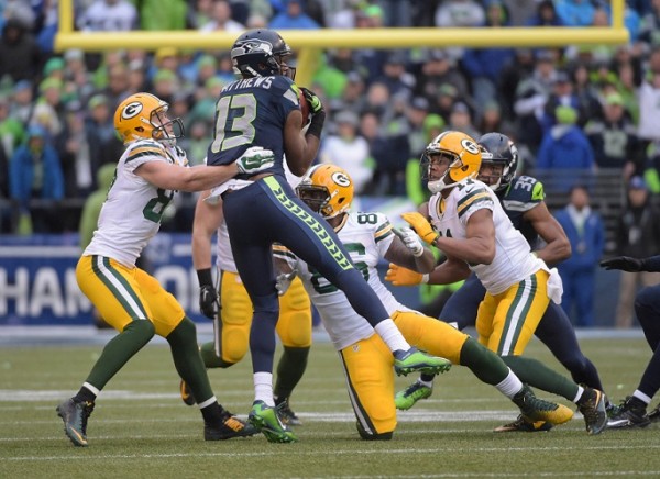 Seahawks wide receiver Chris Matthews (13) recovers an onside kick ahead of Green Bay Packers wide receiver Jordy Nelson (87) and Brandon Bostick (86) during the fourth quarter in the NFC Championship Game at CenturyLink Field. 