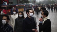 Expats in China use masks to cope with air pollution