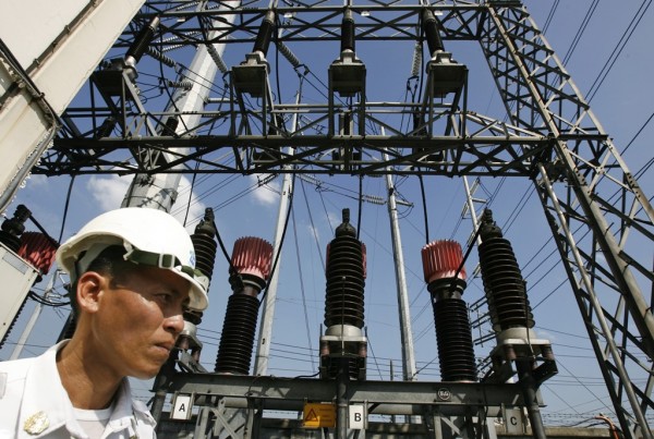 A security guard walks inside a substation of NGCP