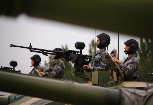 Soldiers of People's Liberation Army inside tanks at drill in Beijing. July 22, 2014.