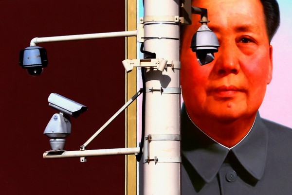 Security cameras infront of giant portrait of former Chinese Chairman Mao Zedong in Beijing's Tiananmen Square. Nov. 11, 2012.