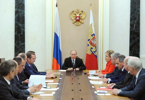 Russian President Vladimir Putin (C) presides over a U.N. Security Council meeting in Moscow, March 6, 2015. 