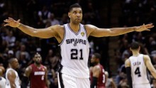 San Antonio Spurs' Tim Duncan raises hands as they win against Miami in their 1st game of the NBA Finals