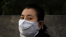 Chinese Woman Using A Mask