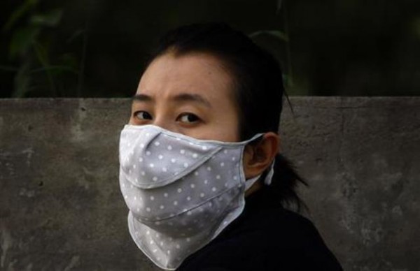 Chinese Woman Using A Mask