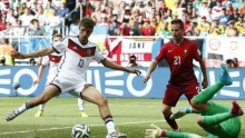Germany's Thomas Mueller scores his team's fourth goal against Portugal