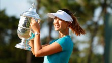 Michelle Wie collects her trophy after winning the 2014 U.S. Women's Open golf tournament