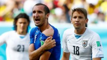 Italian player Giorgio Chiellini shows off apparent bite mark left by Uruguay's Luis Suarez.