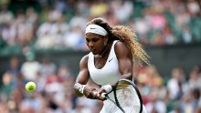 Serena Williams delivers a crushing double-backhand at the 2014 Wimbledon Championships