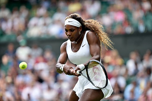 Serena Williams delivers a crushing double-backhand at the 2014 Wimbledon Championships