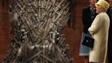 Queen Elizabeth II stops by to admire the Iron Thrones, the seat of power in medieval fantasy TV series 