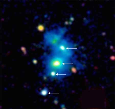 This quasar quartet are found inside a giant nebula that spans one million light years across.