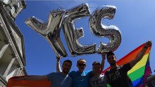 Same-sex marriage supporters pose for a photograph at Dublin Castle in Dublin, Ireland May 23, 2015.