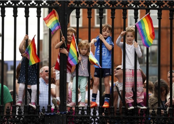 Children wave rainbow flags as they stand with their same-sex marriage supporting parents at Dublin Castle in Dublin, Ireland May 23, 2015.
