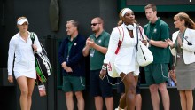 Serena Williams and Alize Cornet walks to Court No. 1 at the All England Club