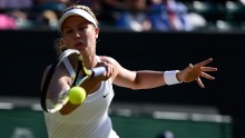 Eugenie Bouchard stretches for a forehand return in her fourth round match