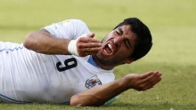Uruguay's Luis Suarez reacts after the controversial collision with Italy's Giorgio Chiellini during the  Italy-Uruguay match on 24 June.