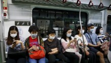 Passengers wearing masks to prevent contracting Middle East Respiratory Syndrome (MERS) 