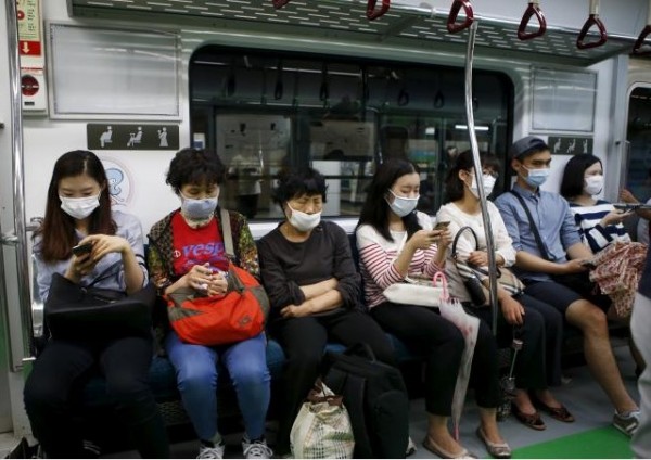Passengers wearing masks to prevent contracting Middle East Respiratory Syndrome (MERS) 