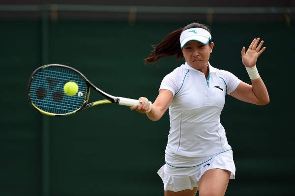 Jhie Zheng delivers a forehand smash in the ongoing Wimbledon Championships