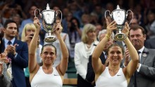Italian's Sara Errani and Roberta Vinci raising their ladies' doubles Wimbledon trophies