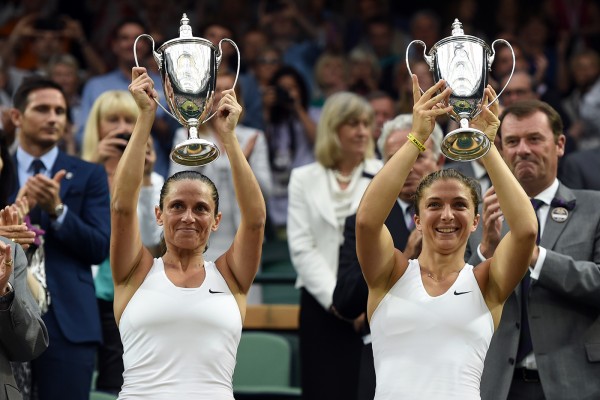 Italian's Sara Errani and Roberta Vinci raising their ladies' doubles Wimbledon trophies
