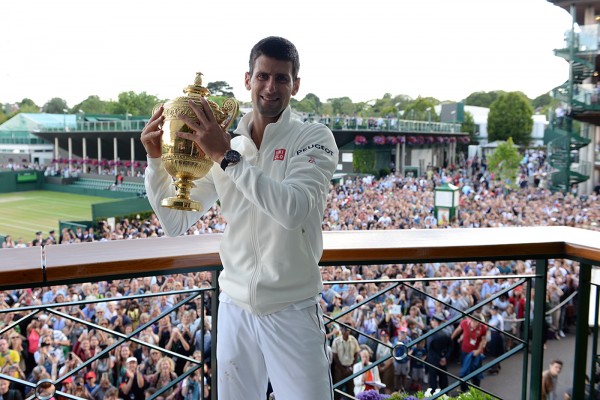 Serbian Novak Djokovic raising his 2014 Wimbledon Championship cup
