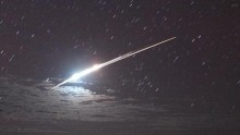 The successful re-entry of the Japanese space probe Hayabusa causing a bright streak in the night sky