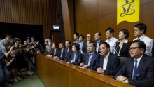 Lawmakers supporting a Beijing-backed electoral reform, meet journalists after a voting at Legislative Council in Hong Kong, China June 18, 2015.