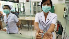 A nurse sanitizers her hands to prevent contracting Middle East Respiratory Syndrome (MERS)