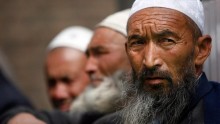 Uighur men wait for the beginning of Friday prayers inside Altyn Mosque in Yarkand, in Yarkant county, Xinjiang, China.