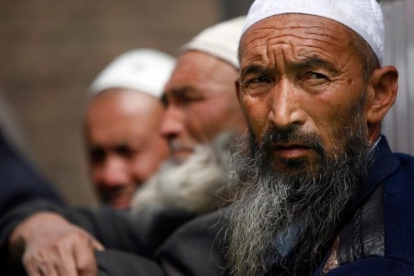 Uighur men wait for the beginning of Friday prayers inside Altyn Mosque in Yarkand, in Yarkant county, Xinjiang, China.