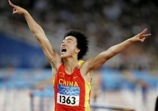 China's Liu Xiang celebrates as he crosses the finish line to win the men's 110 metres hurdle final at the Athens 2004 Olympic Summer Games in this August 27, 2004 file photo