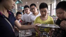 Chinese Boys Lining Up To Obtain Healthy Meals