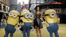 Actress Sandra Bullock poses with characters in costume from the film during the 