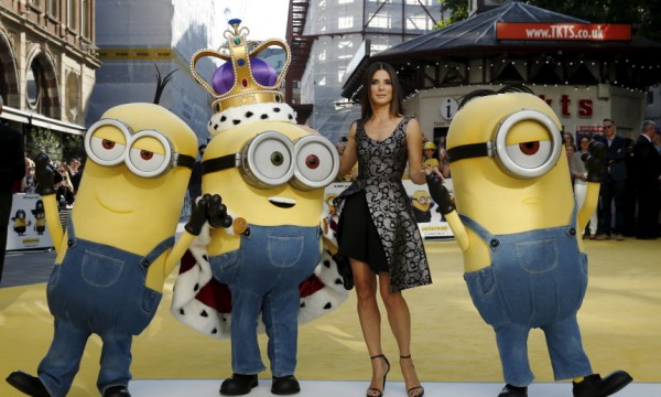Actress Sandra Bullock poses with characters in costume from the film during the "Minions" World Premiere at Leicester Square in London, Britain June 11, 2015. 