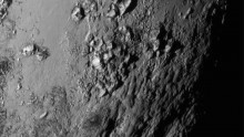 In this handout provided by the National Aeronautics and Space Administration (NASA), a close-up image of a region near Pluto's equator shows a range of mountains rising as high as 11,000 feet (3,500 meters) taken by NASA's New Horizons spacecraft as it p