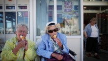 People enjoying ice cream during a hot summer day.