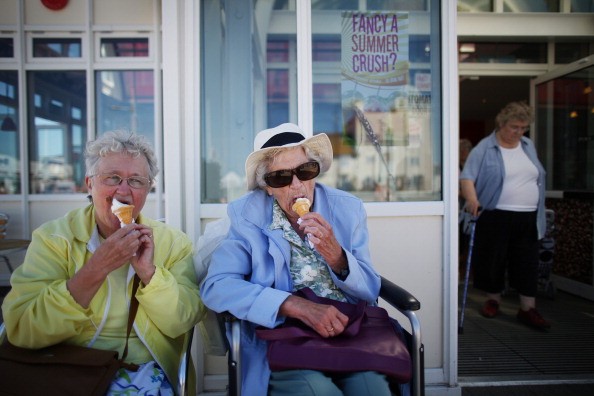 People enjoying ice cream during a hot summer day.