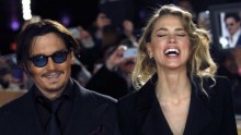 Actor Johnny Depp and girlfriend Amber Heard laugh as they arrive for the UK premiere of ''Mortdecai'' at Leicester Sqaure in London January 19, 2015.