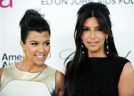 A 2012 file photo of siblings Kim and Kourtney Kardashian at the 20th annual Elton John AIDS Foundation Academy Awards Viewing Party.