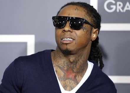 Rapper Lil Wayne poses on arrival at the 53rd annual Grammy Awards in Los Angeles, California in this February 13, 2011 file photo.