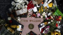 An August 2014 file photo showing flowers fans left at Robin Williams' star at the Hollywood walk of Fame after news of his death.