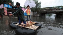 People struggling in flooded areas of Beijing