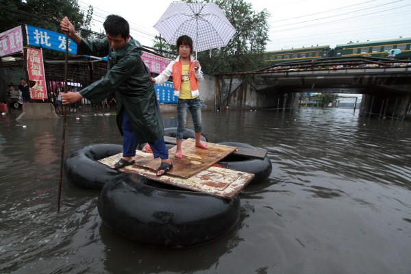 People struggling in flooded areas of Beijing