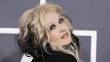 Singer Cyndi Lauper poses as she arrives at the 54th annual Grammy Awards in Los Angeles, California February 12, 2012.